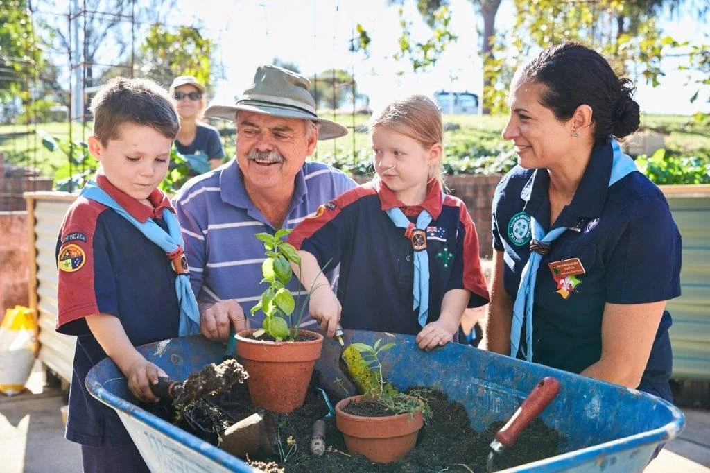 Photo of volunteer helping with planting